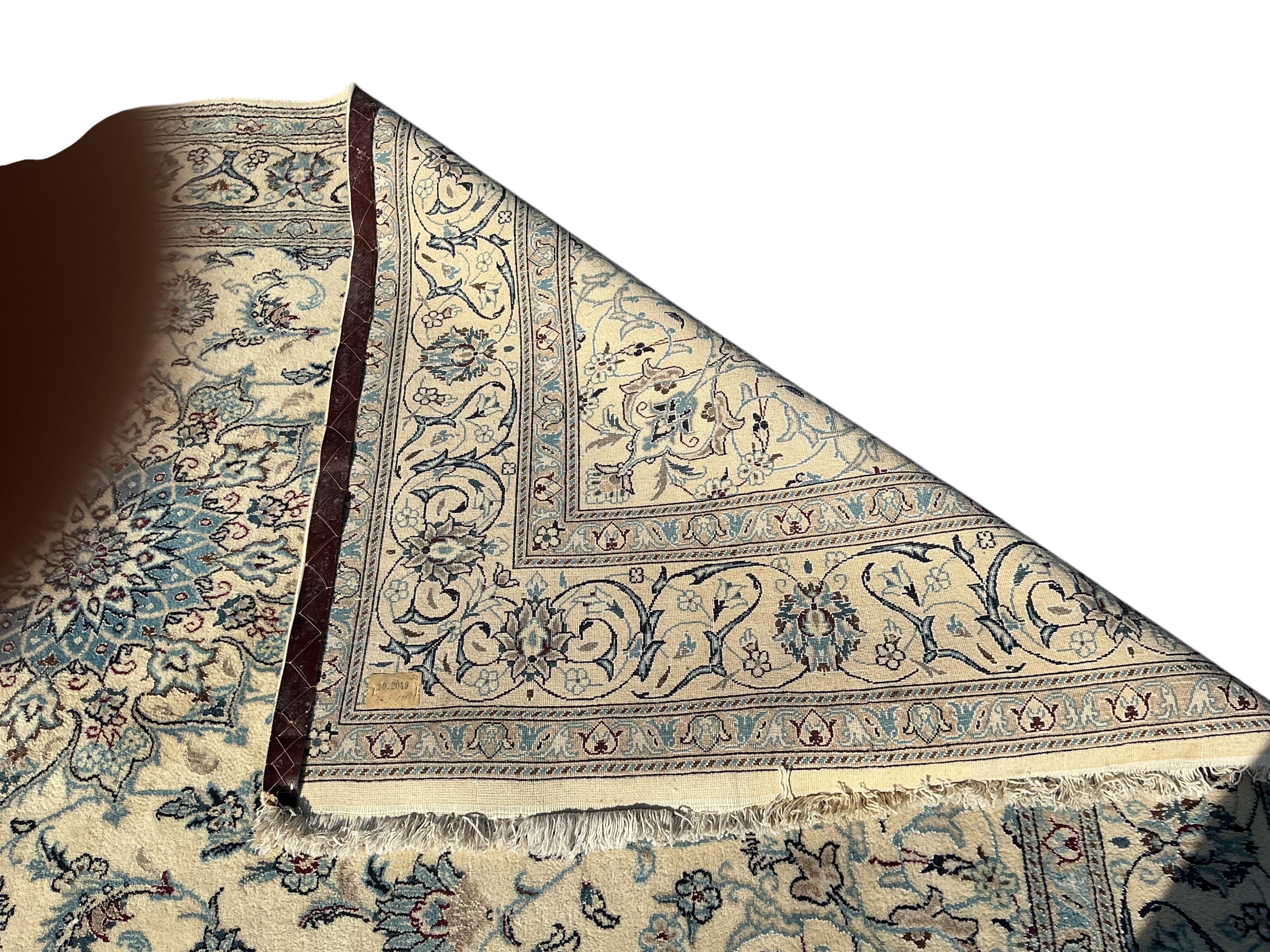 A Tabriz ivory ground carpet, 310 x 195cm
